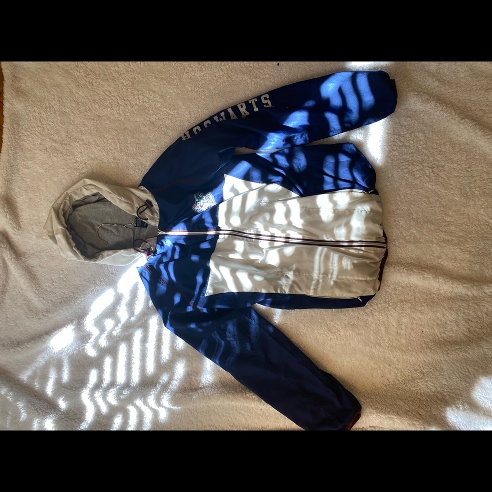 Blue and white Harry Potter Hogwarts windbreaker